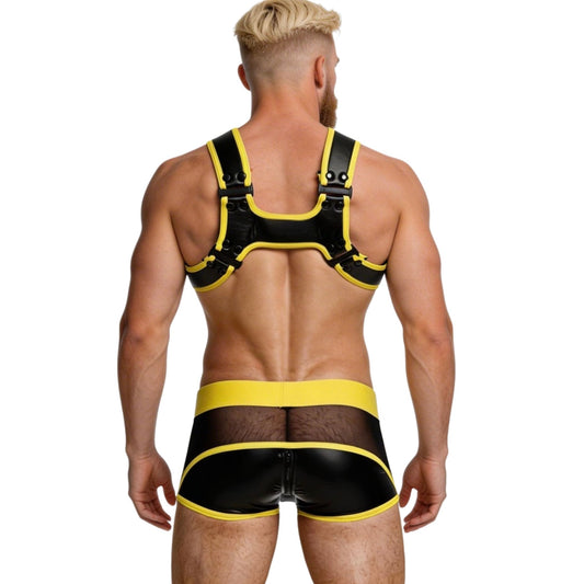 Man wearing a black and yellow harness and underwear set on a white background