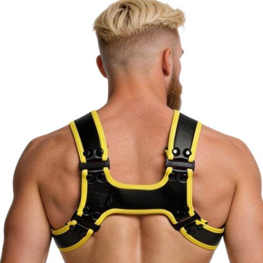 Man wearing a black and yellow harness on a white background