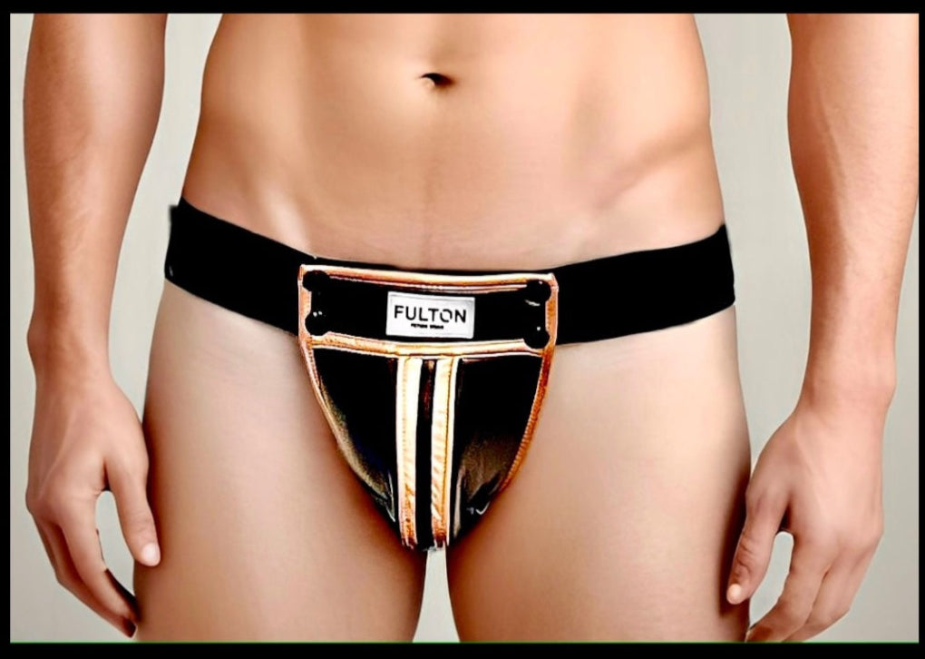 Close-up detail  shot of model wearing the gold metallic trimmed black faux leather construction on jockstrap