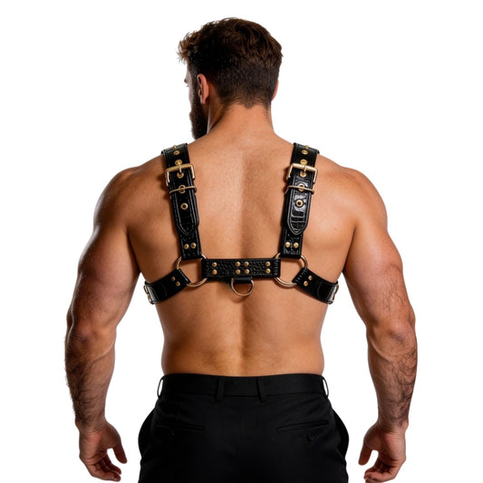 Man wearing a black crocodile leather harness on a white background back view