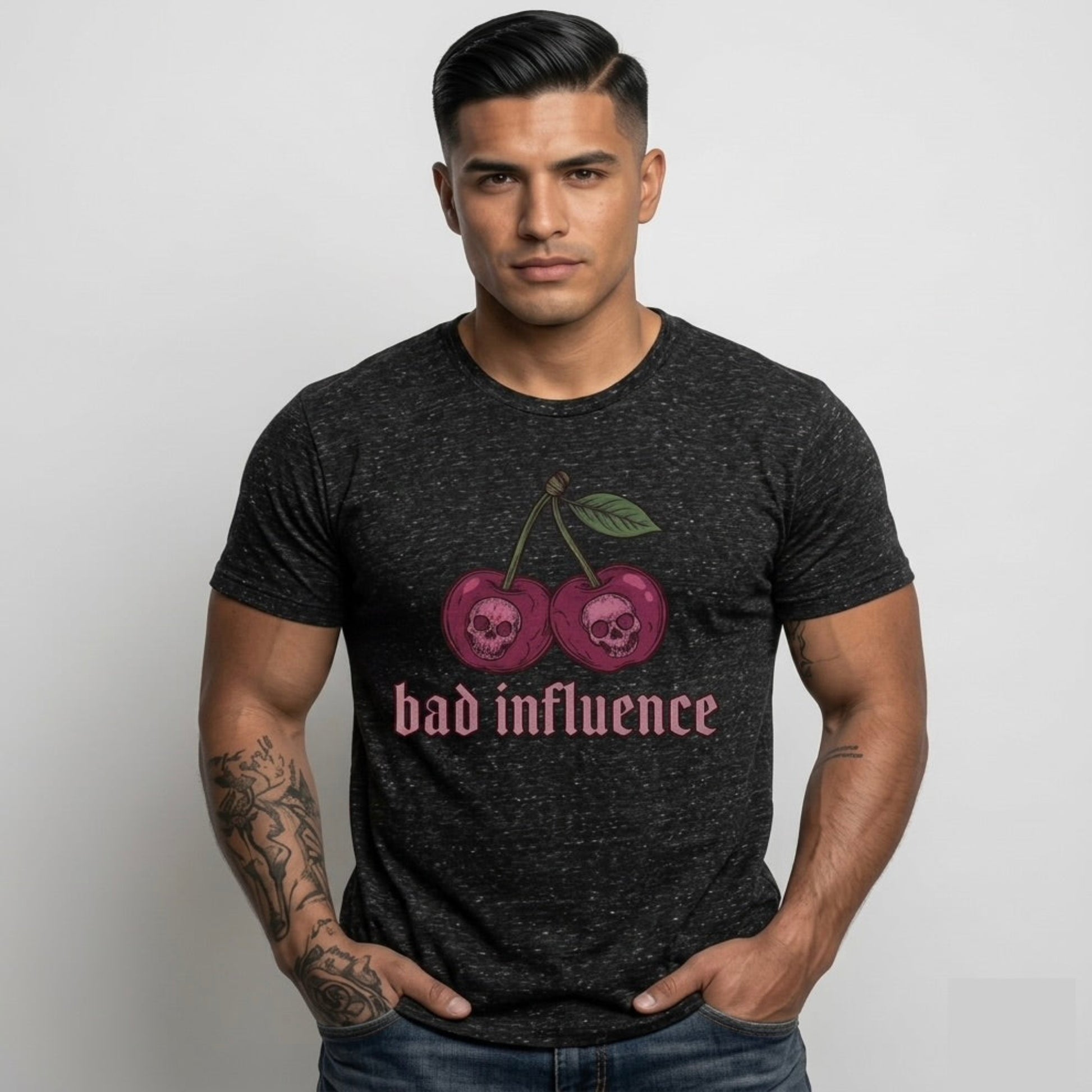 Man wearing a black t-shirt with cherry design and 'bad influence' text on a plain background