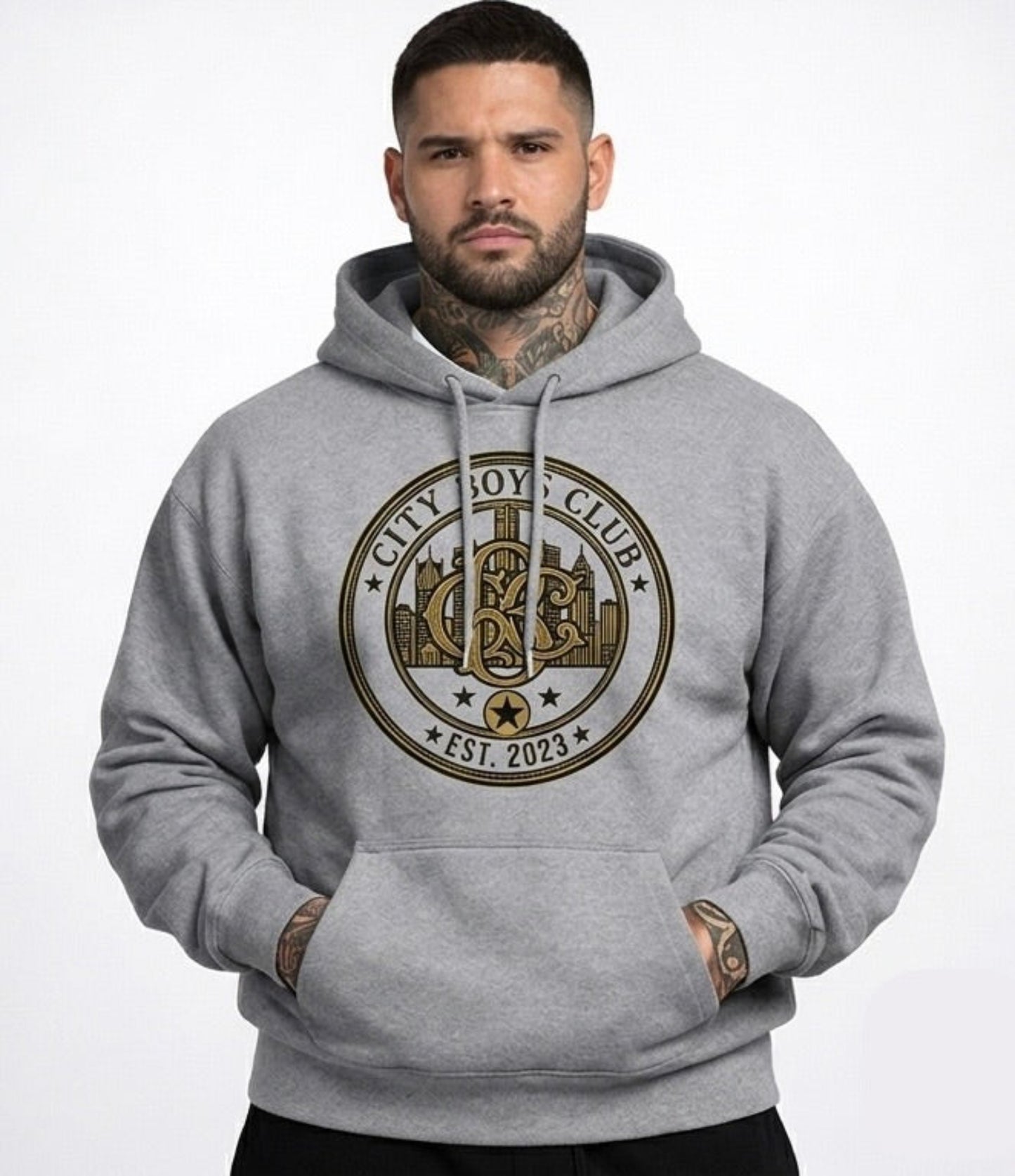 Man wearing a gray hoodie with a club logo on a white background