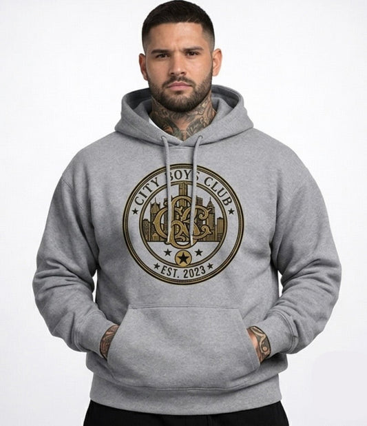 Man wearing a gray hoodie with a club logo on a white background