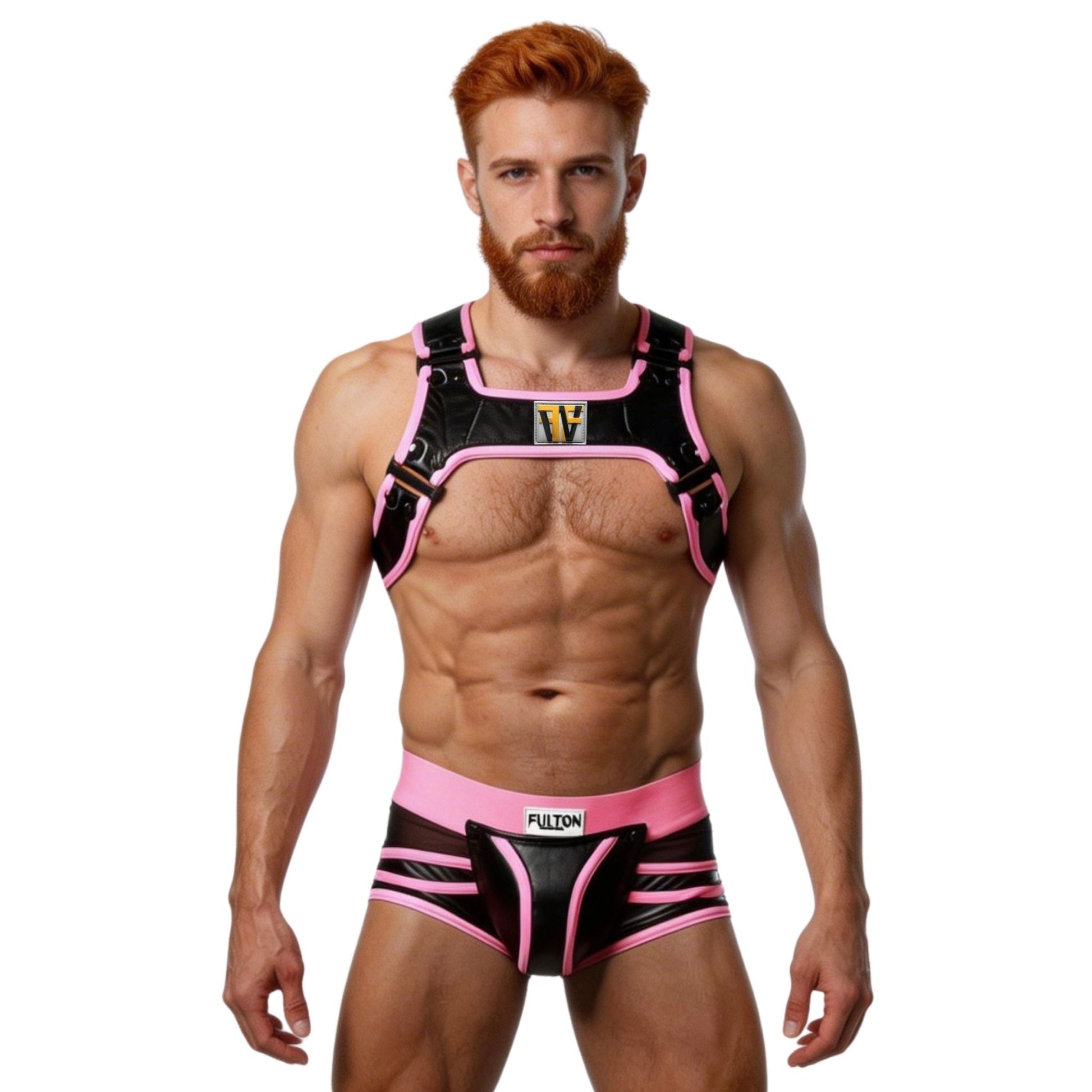 Man wearing a black and pink harness with visible branding and black and pink trunks on a white background
