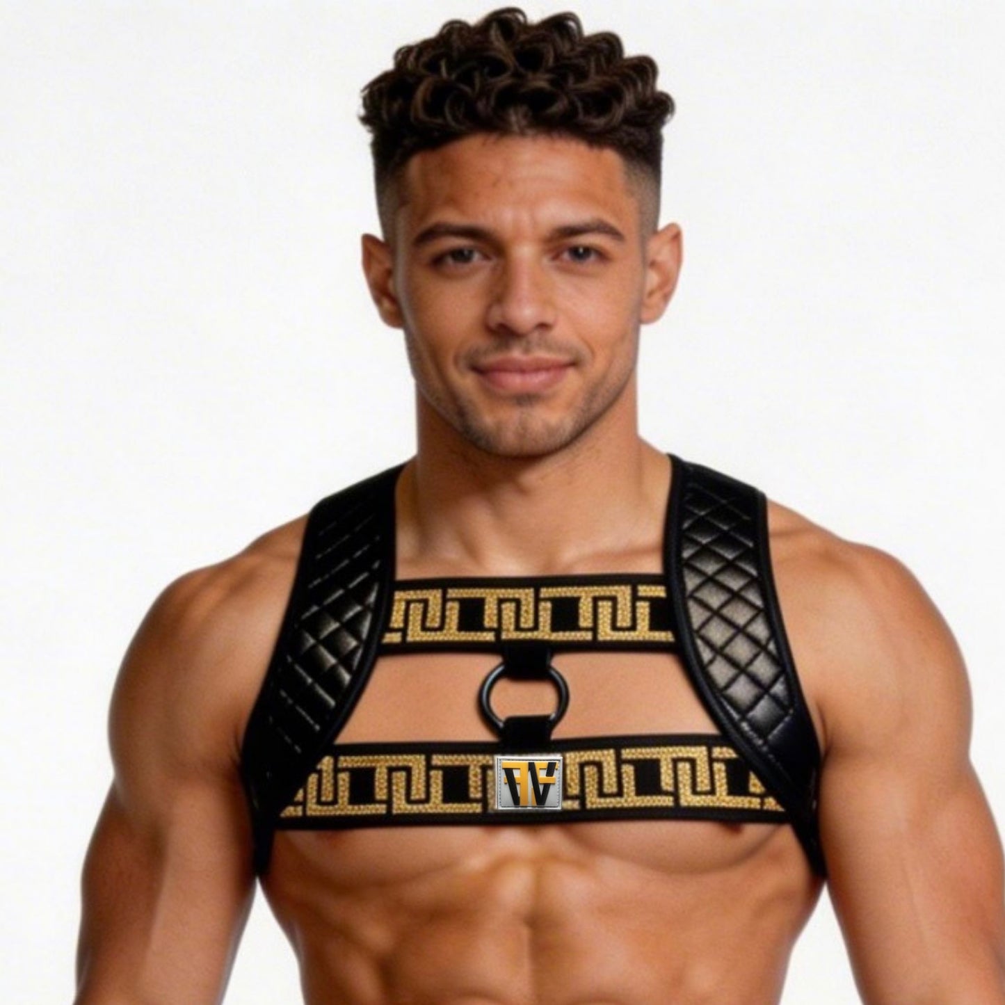 Man wearing a black and gold harness against a plain background