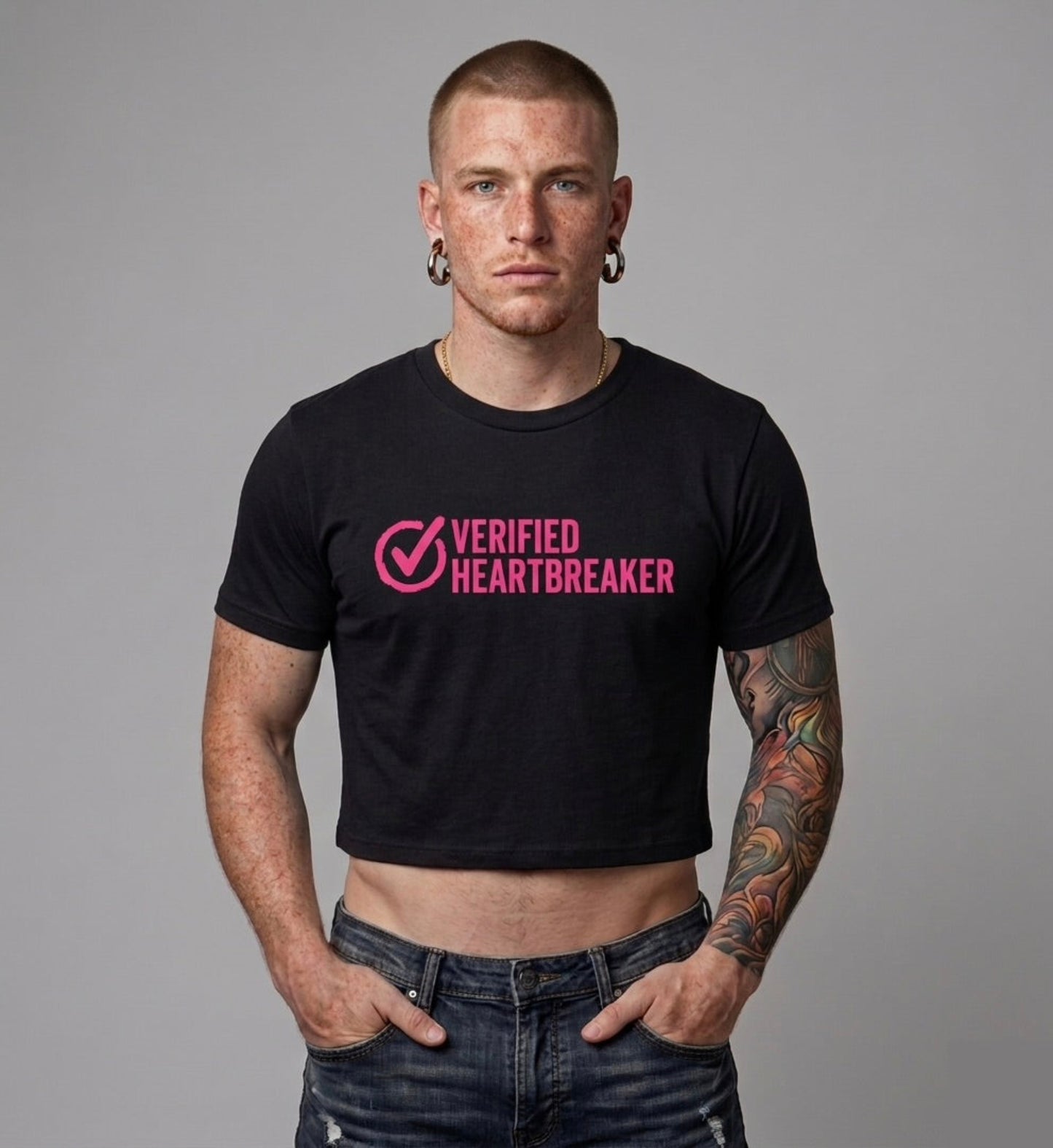 Man wearing a black t-shirt with 'Verified Heartbreaker' text on a gray background