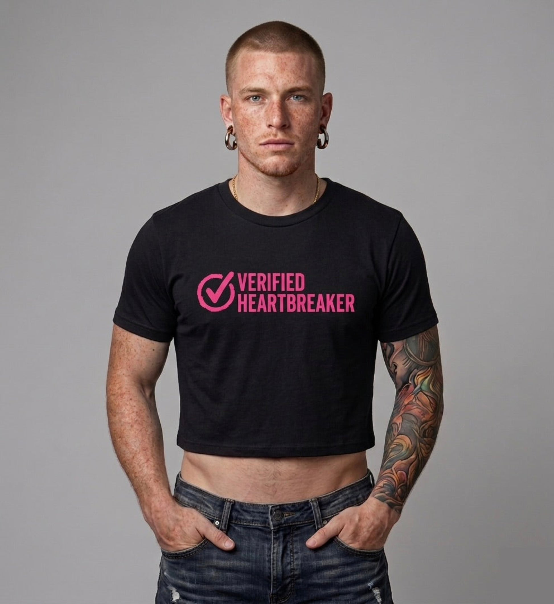 Man wearing a black t-shirt with 'Verified Heartbreaker' text on a gray background